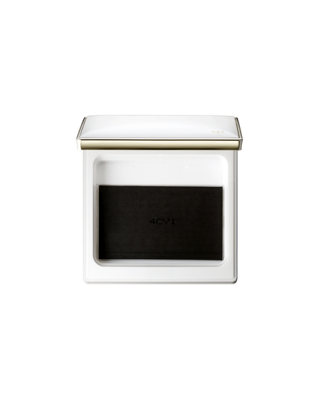 Photo of a case for "BRIGHTENING POWDER FOUNDATION". The lid of the white square compact is open and has the gold brand logo engraved on it on the bottom right corner.