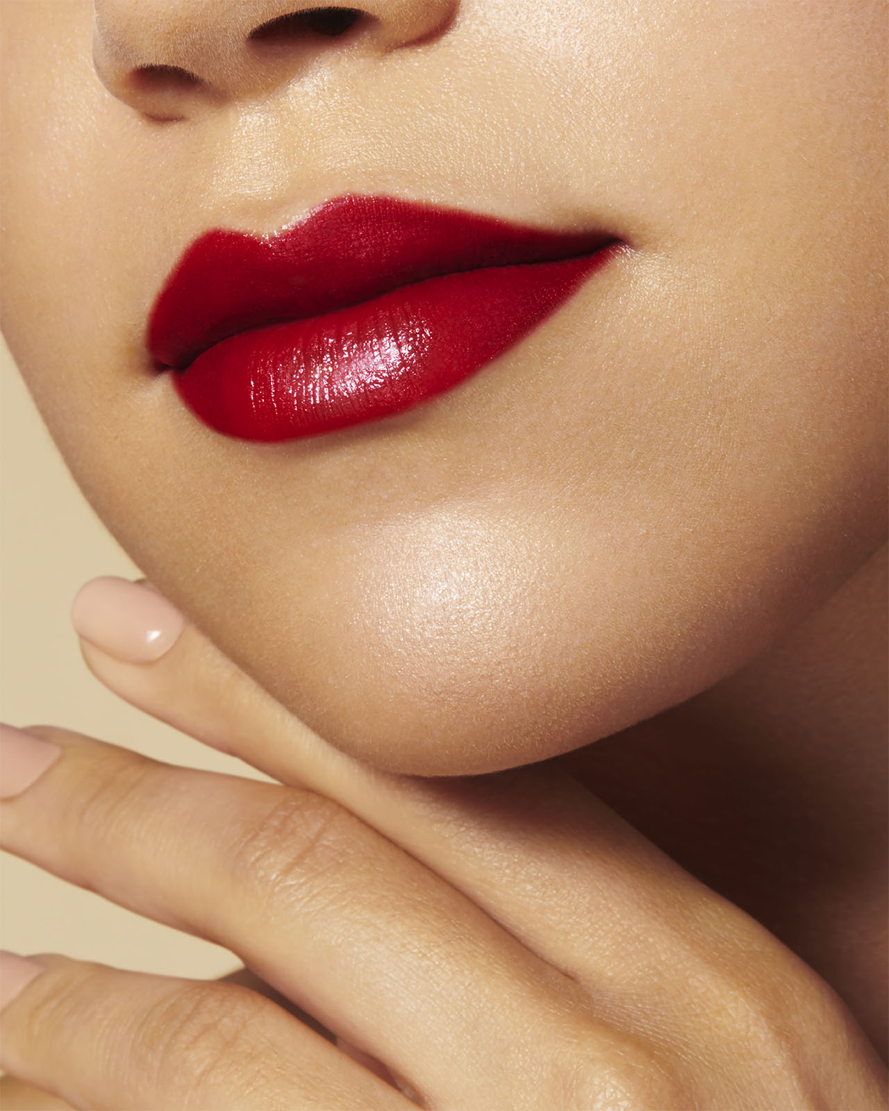 Photo of a deep skin tone model  wearing "THE PRECIOUS LIPSTICK"  on the lips.