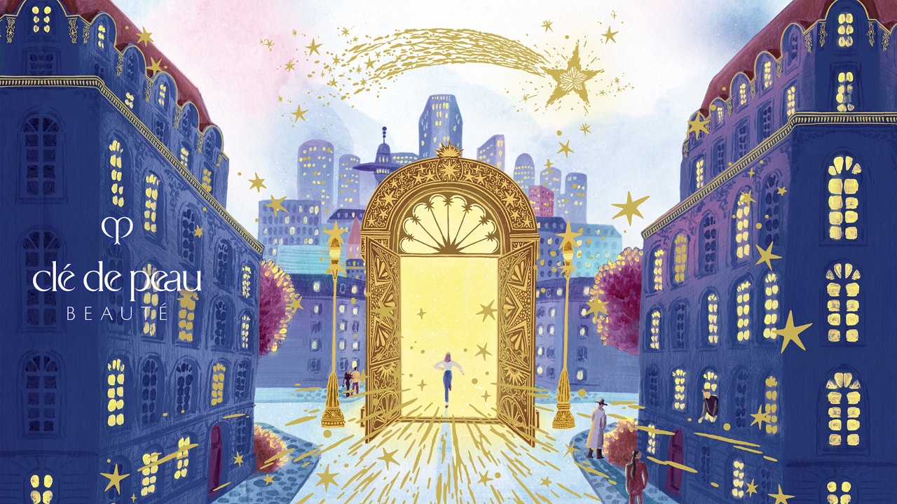 Photo of wallpaper featuring the brand name and logo at the center, surrounded by gold and lavender fireworks motifs in each corner, with a small gold key as part of the design.