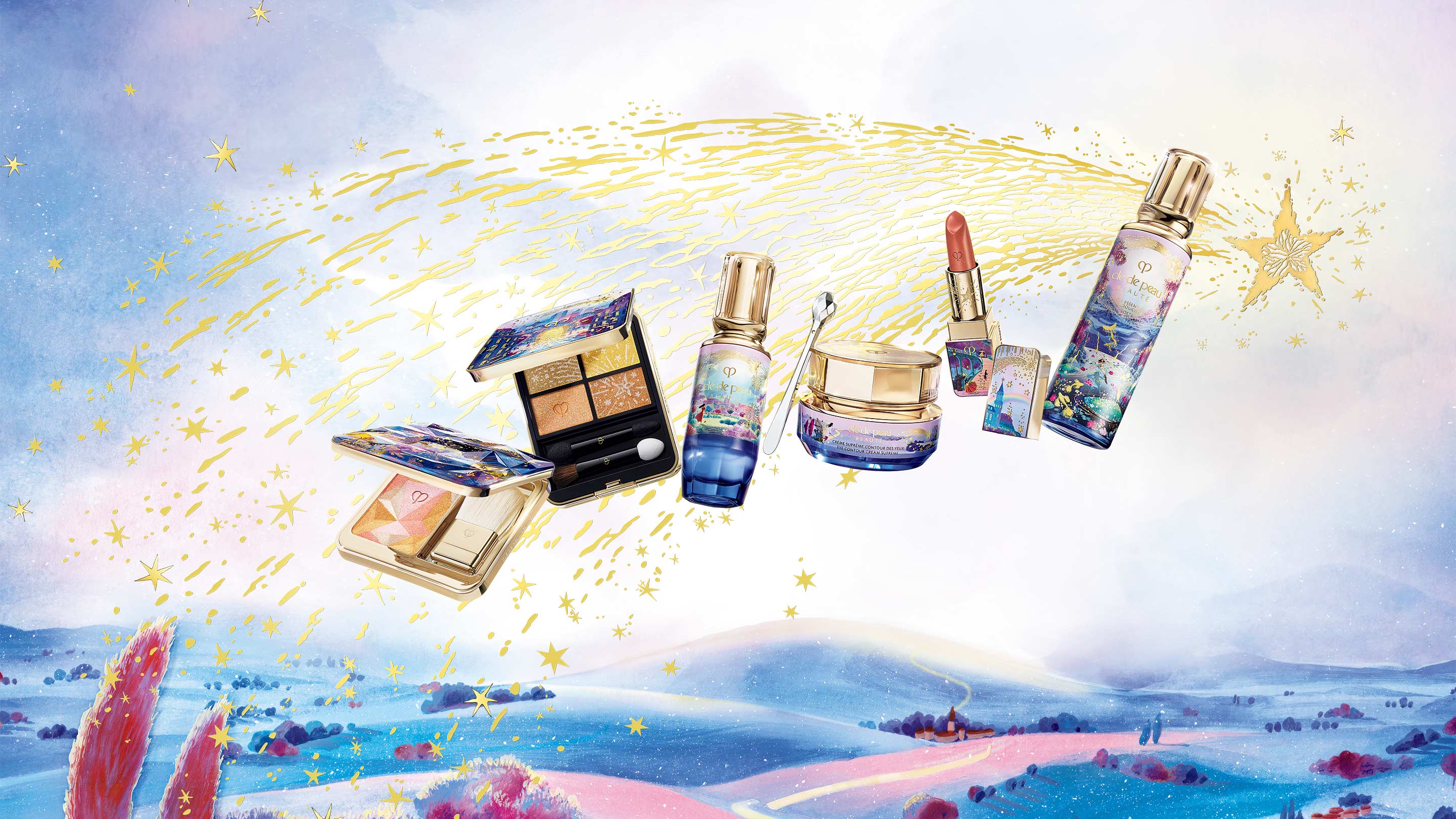 A collection of limited-edition Cl&eacute; de Peau Beaut&eacute; holiday products is displayed against a pastel landscape. Gold stardust and stars sweep across the sky, surrounding products featuring celestial artwork on the packaging. 